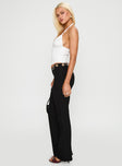 side view of model wearing Princess Polly True Grit Eyelet Flare Pants Black Low Rise Pants
