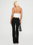 back view of model wearing Princess Polly True Grit Eyelet Flare Pants Black Low Rise Pants