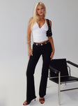 side view of model wearing Princess Polly True Grit Eyelet Flare Pants Black Low Rise Pants 